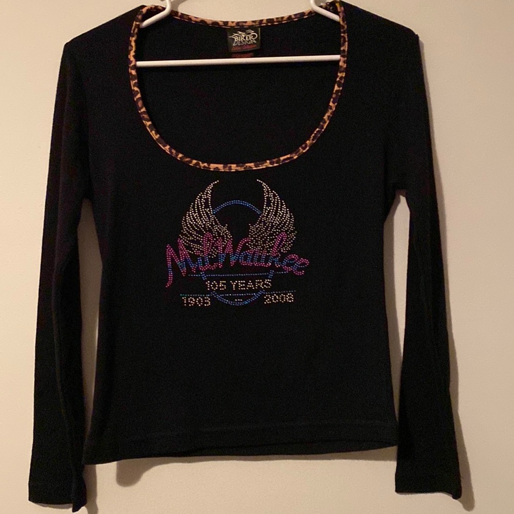 Ladies biker shirt size small with Milwaukee and “Harley” logo. Never worn